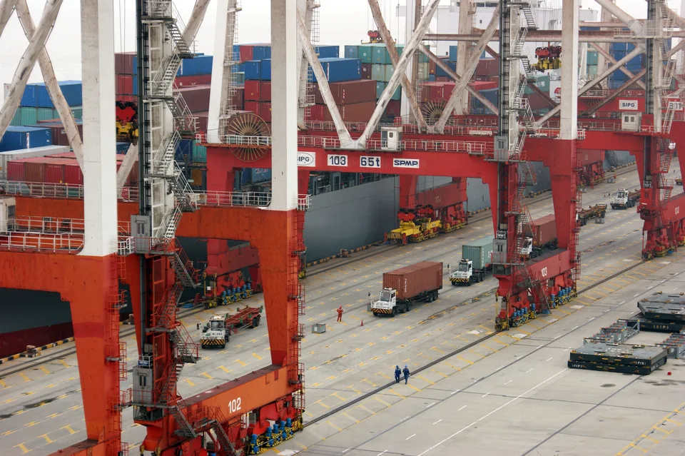 Genuine photograph of containers and loading cranes at Yangshan Deepwater Port near Shanghai, China