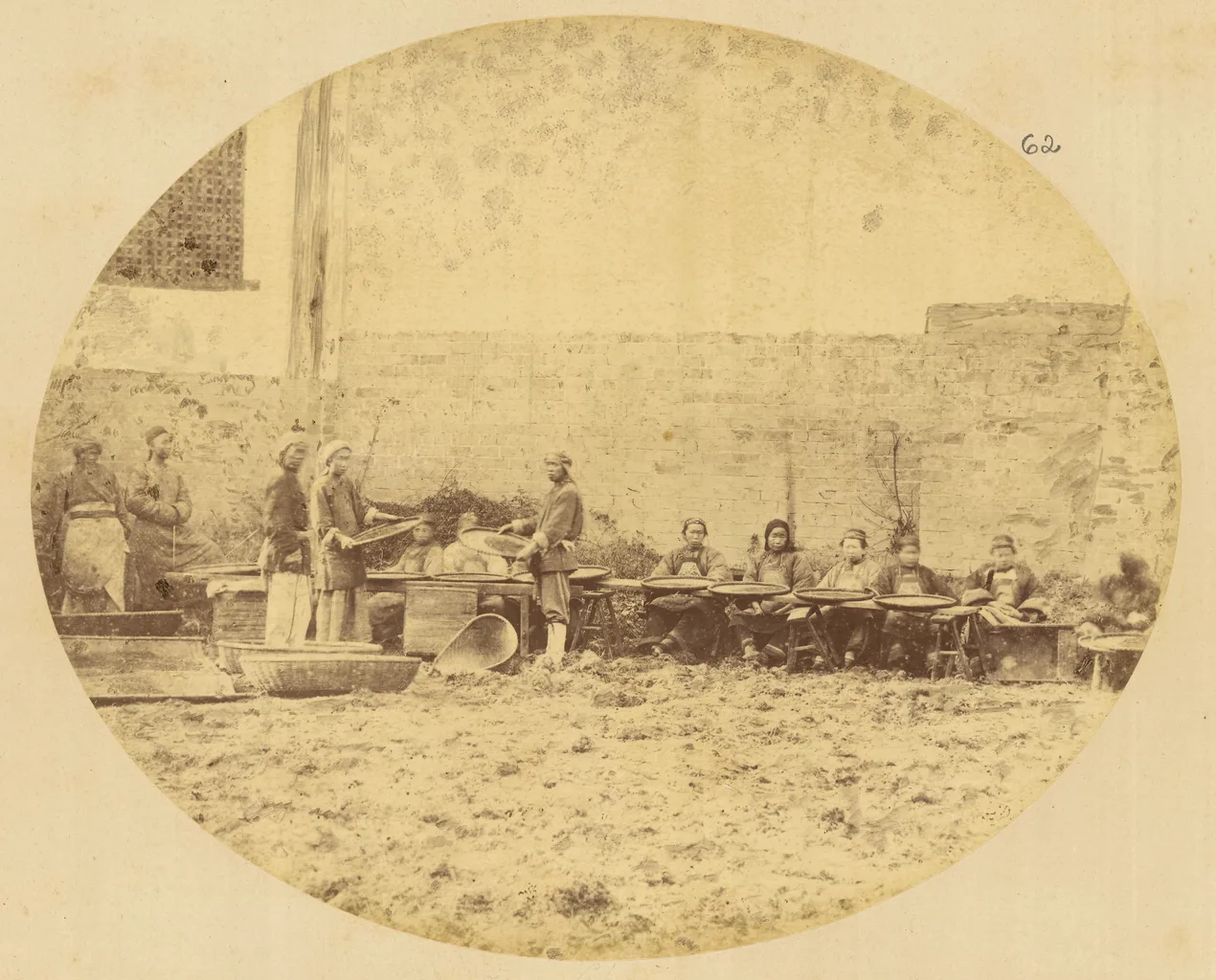 Workers grading dried tea in Yangloudong, Hubei, China, in 1874